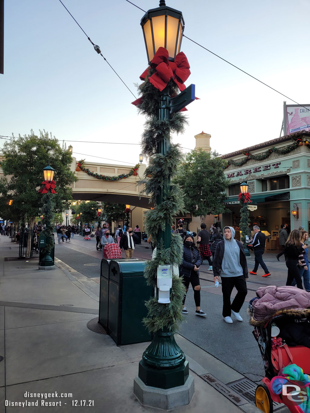 Hand sanitizer dispensers are now bolted to lamp posts on Buena Vista Street and Main Street.