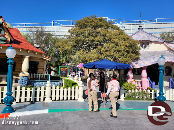 A number of Cast Members gathered between Mickey and Minnies.  These appear to be greeters and then guest relations CMs to sign people in for the private gatherings in Mickey's House that are available for purchase.