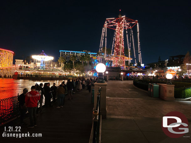 The line to pick up food stretches almost to the center of Paradise Gardens Park