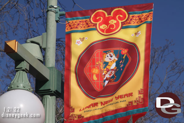 Banners featuring characters line the parade route.