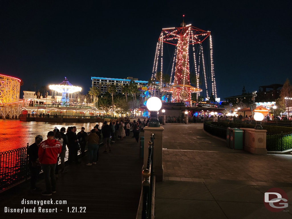 The line to pick up food stretches almost to the center of Paradise Gardens Park