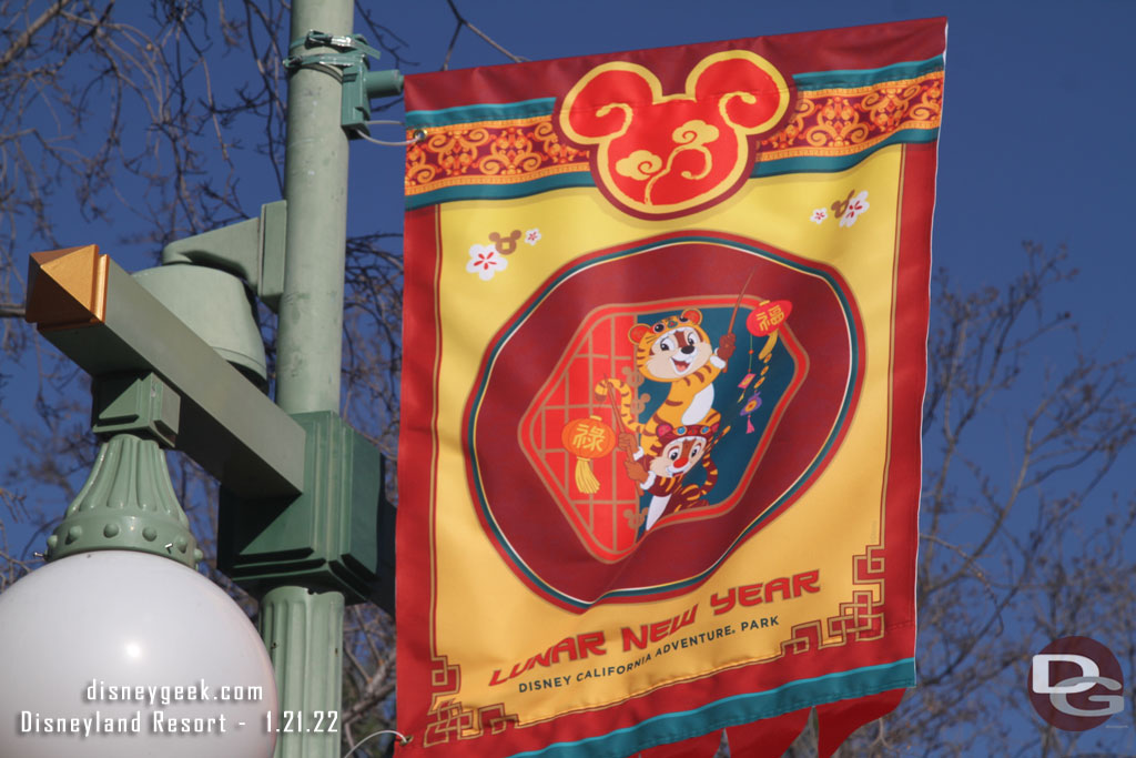 Banners featuring characters line the parade route.