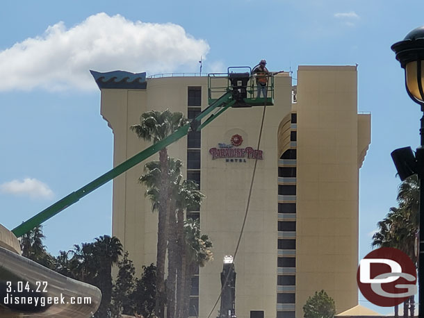 A crew member spraying water to help keep the dust down.  There still was some drifting into the walkway.  You could see and smell it.