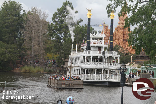 A raft passing the Mark Twain.