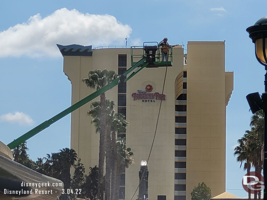 A crew member spraying water to help keep the dust down.  There still was some drifting into the walkway.  You could see and smell it.