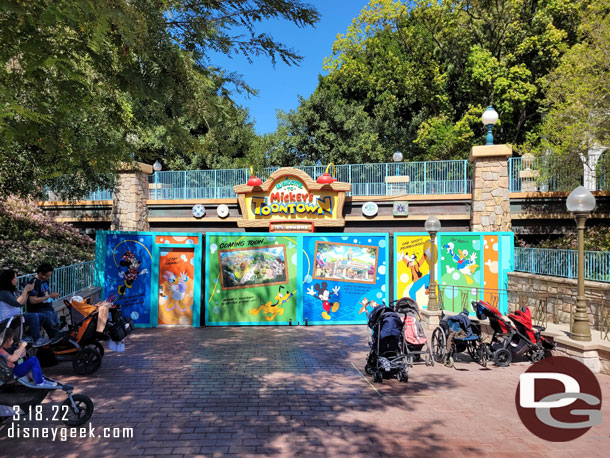 Toontown is closed until next year.  The walls are up at the train crossing.  With the trees grown in there are views of the work going on.  Too bad they did not opt to put a couple windows in the wall.