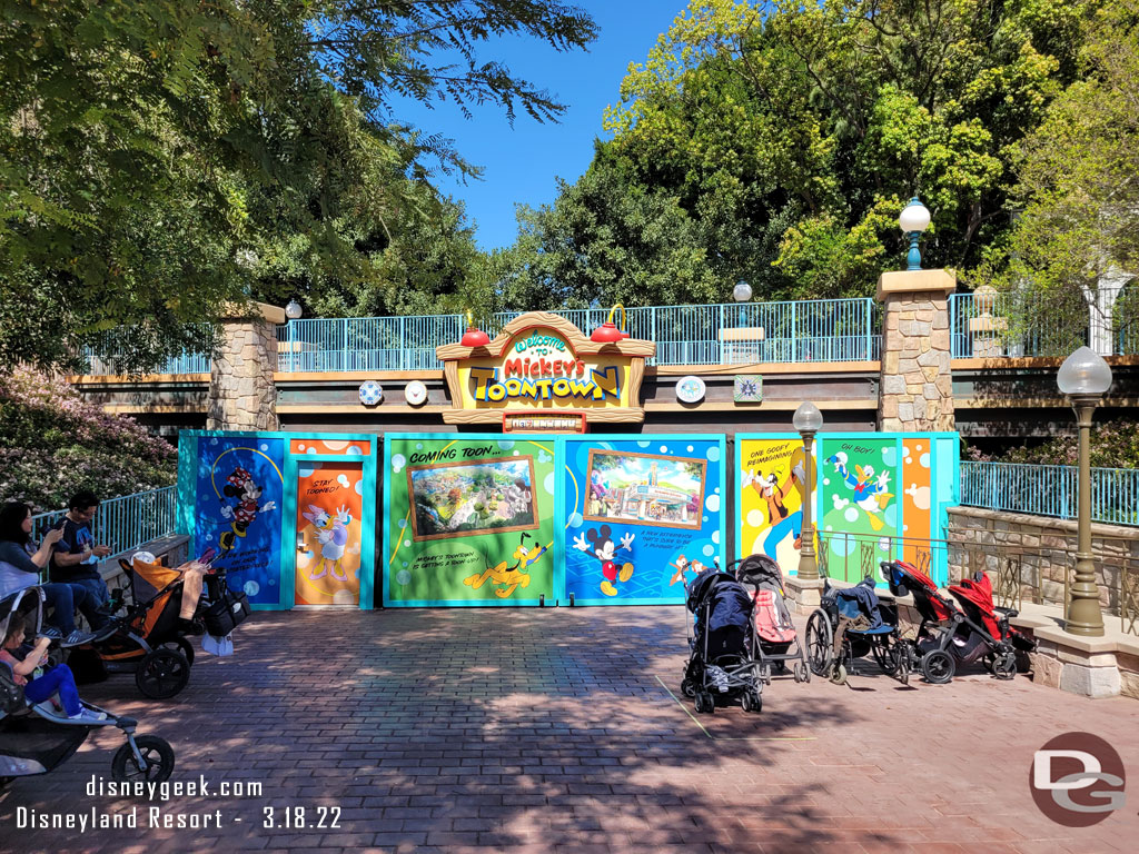 Toontown is closed until next year.  The walls are up at the train crossing.  With the trees grown in there are views of the work going on.  Too bad they did not opt to put a couple windows in the wall.