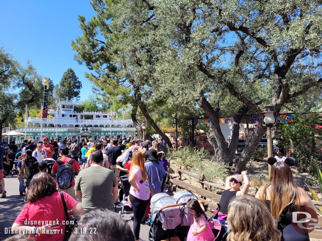 On the right is a line for the character meet and greet location.  The location features Miguel from Coco and Mirabel from Encanto rotating throughout the day.