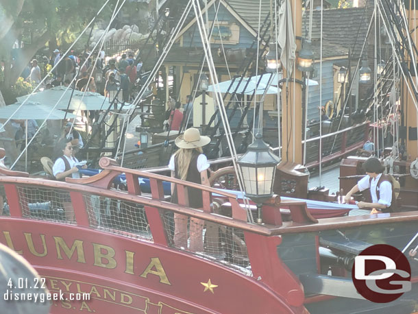 The Columbia had just finished its day and the crew was folding the flag as we cruised by.