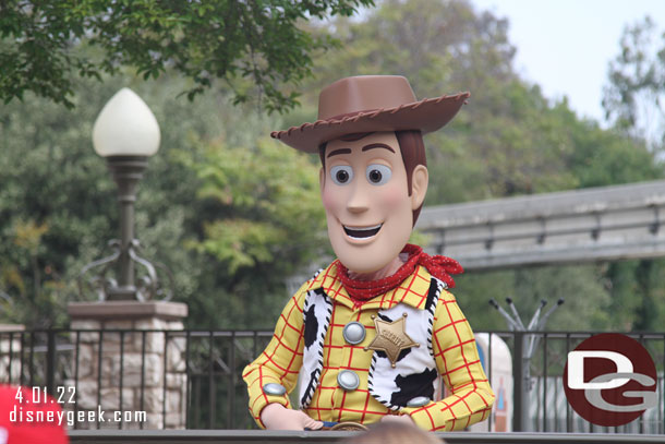 Woody greeting guests in the small world mall area.