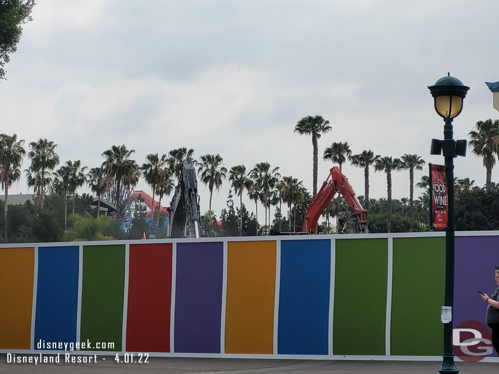 Machines were at work on the other side of the wall sorting out the rubble.