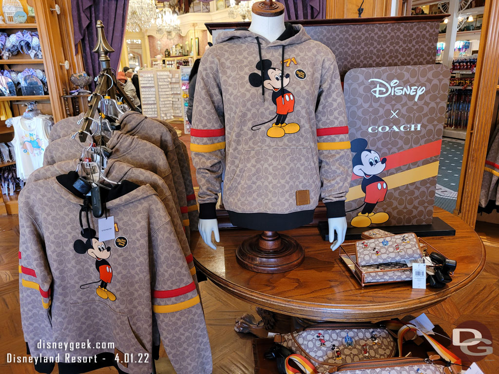 Disney x Coach merchandise featured in a couple displays.