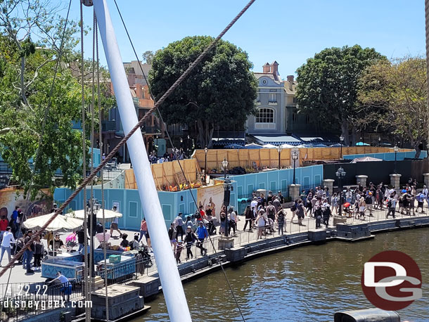 The walls have been moved and they are working on the walkway closer to the attraction attraction entrance now.