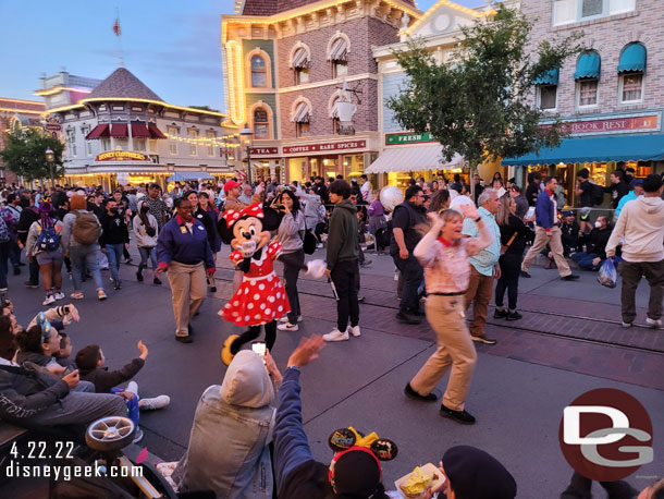 Minnie Mouse visiting the waiting crowd on Main Street USA