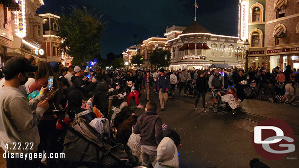 Mickey Mouse high fiving guests.