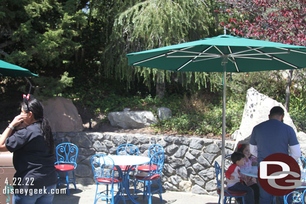 Tables and chairs are back across from the restrooms.