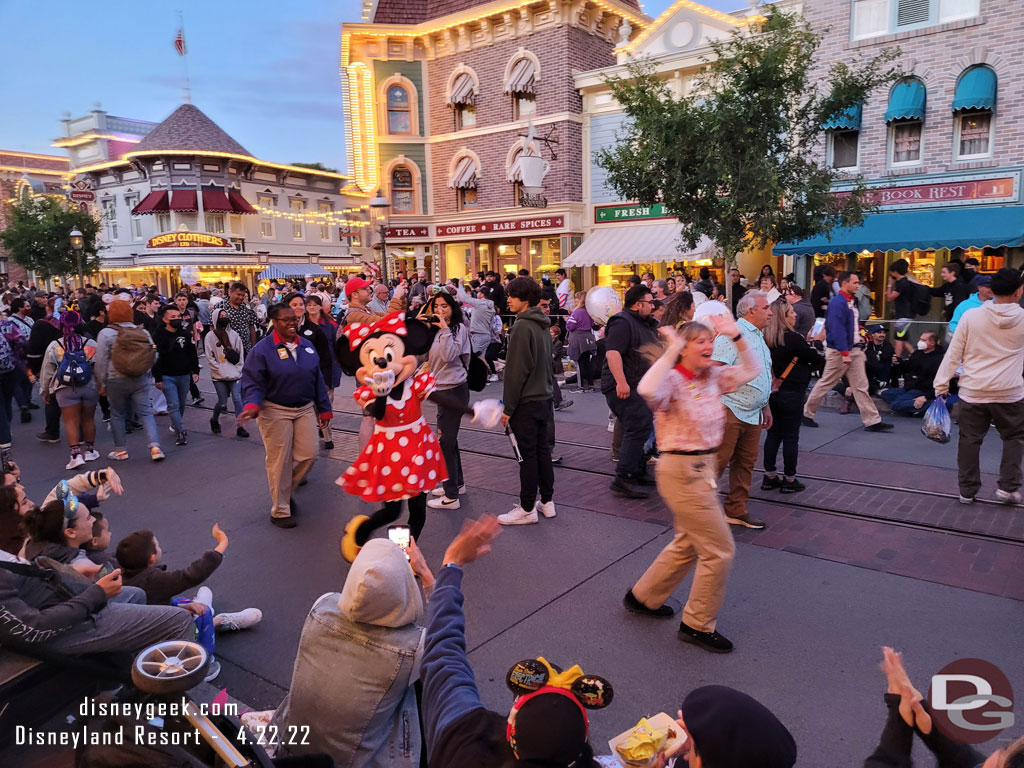 Minnie Mouse visiting the waiting crowd on Main Street USA