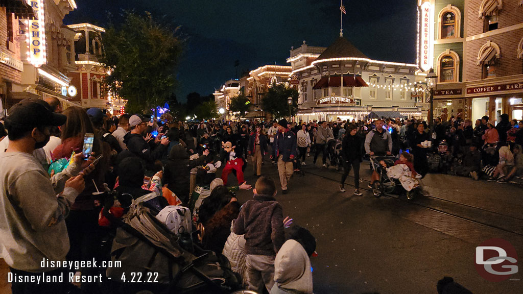 Mickey Mouse high fiving guests.