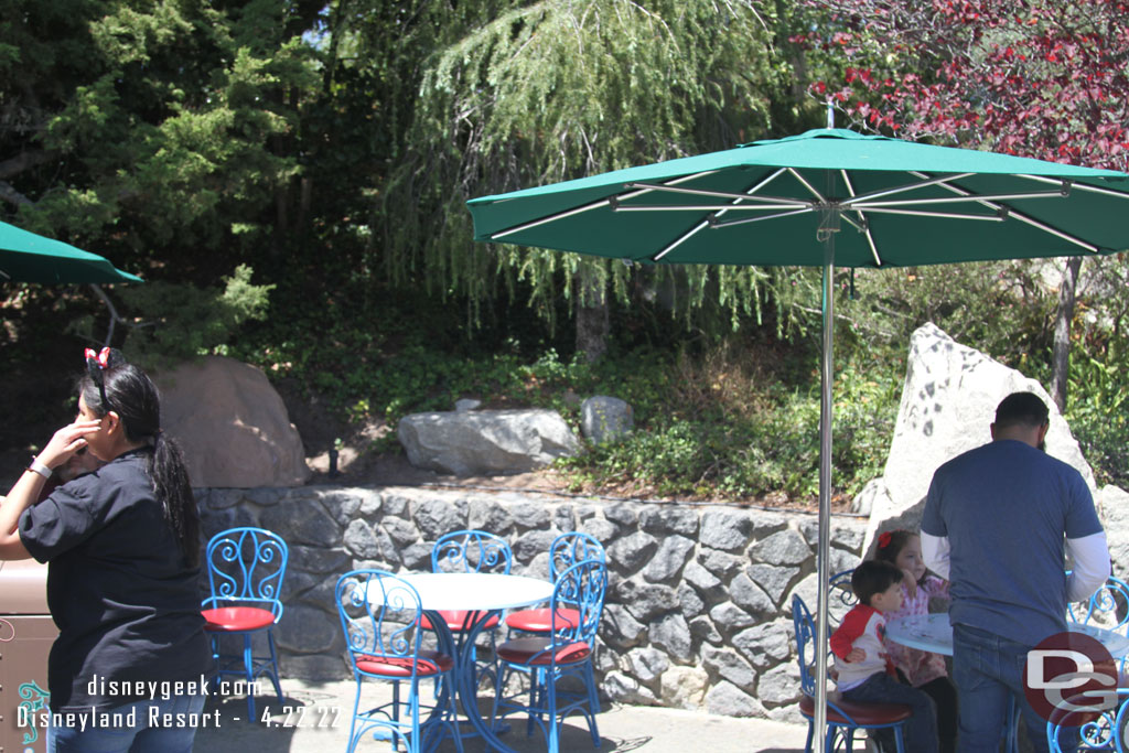 Tables and chairs are back across from the restrooms.