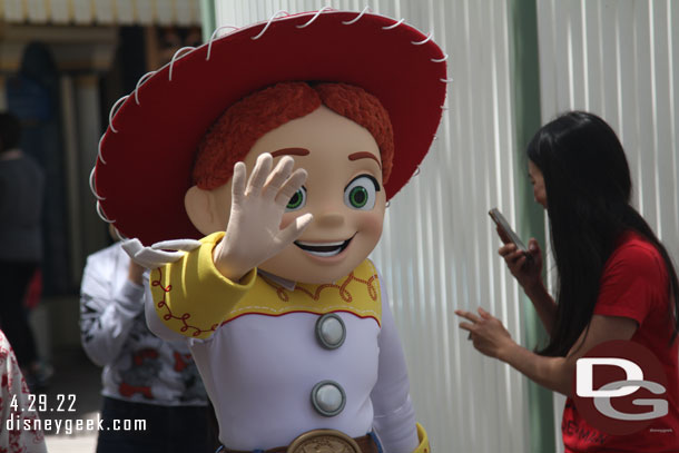 Jessie meeting guests near Toy Story Midway Mania.