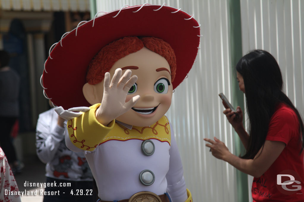 Jessie meeting guests near Toy Story Midway Mania.