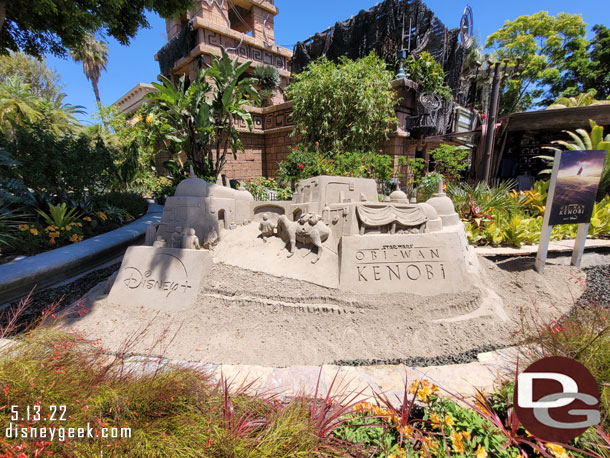 A sand sculpture in the garden near the Star Wars Trading Post promoting the upcoming Obi-Wan Kenobi series on Disney+