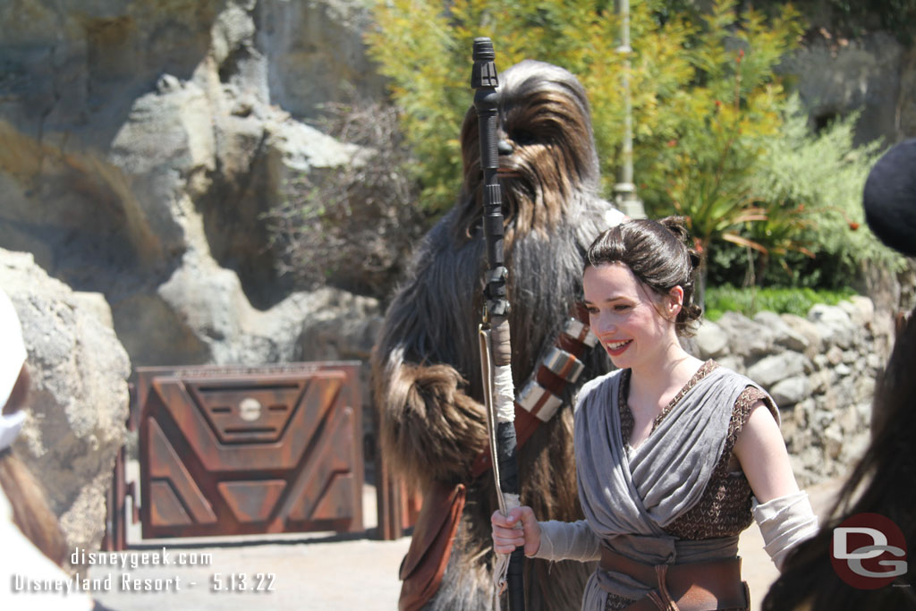 Rey and Chewie out working on an X-Wing and meeting guests.