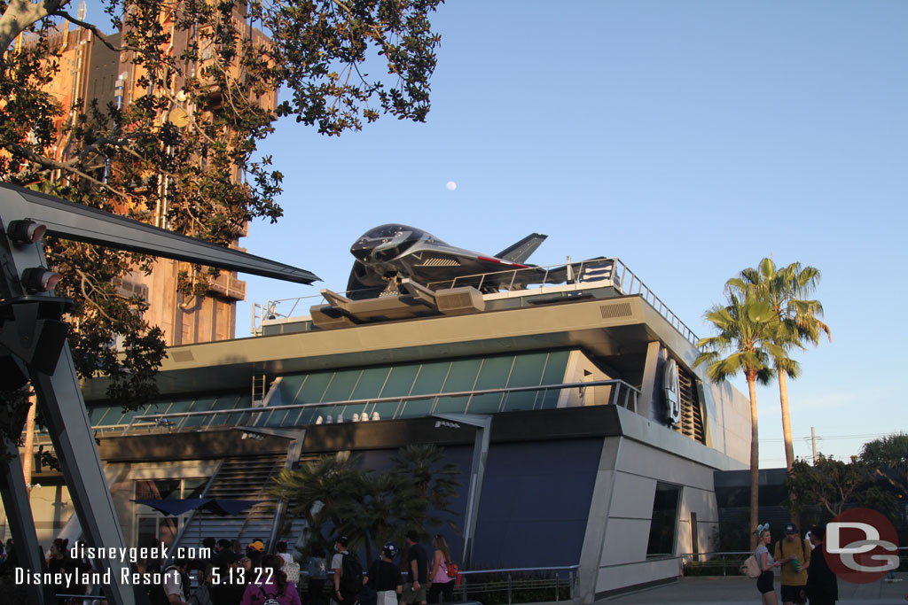 The moon rising over Avengers Campus