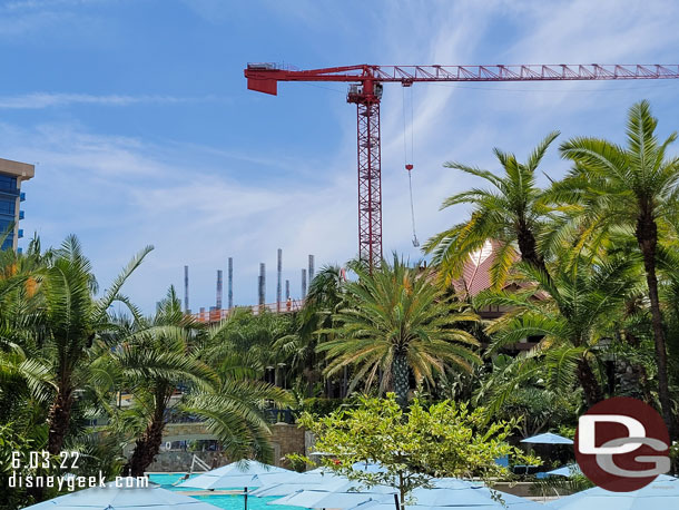 You can now see the building beyond the pool.