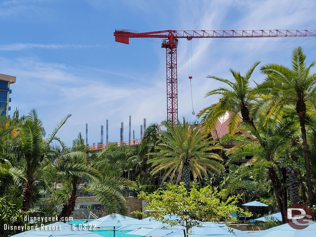 You can now see the building beyond the pool.