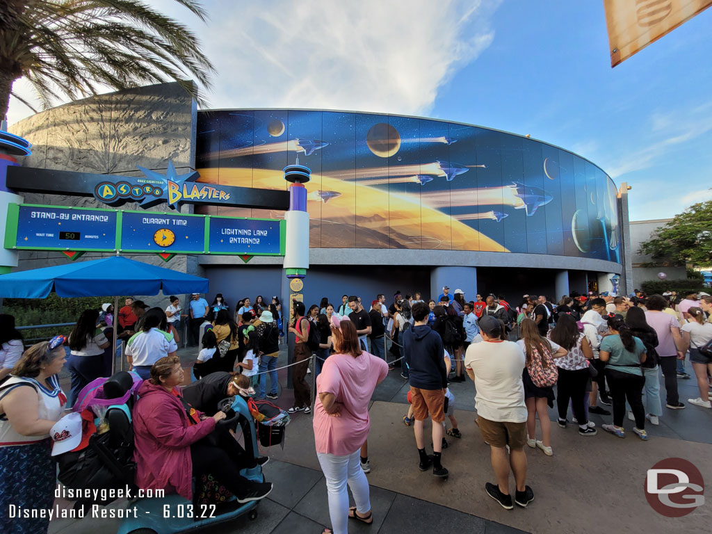 All those people are in the Lightning Lane return queue for Buzz Lightyear.