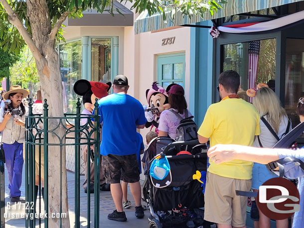 Mickey and Minnie visiting guests near Trolley Treats