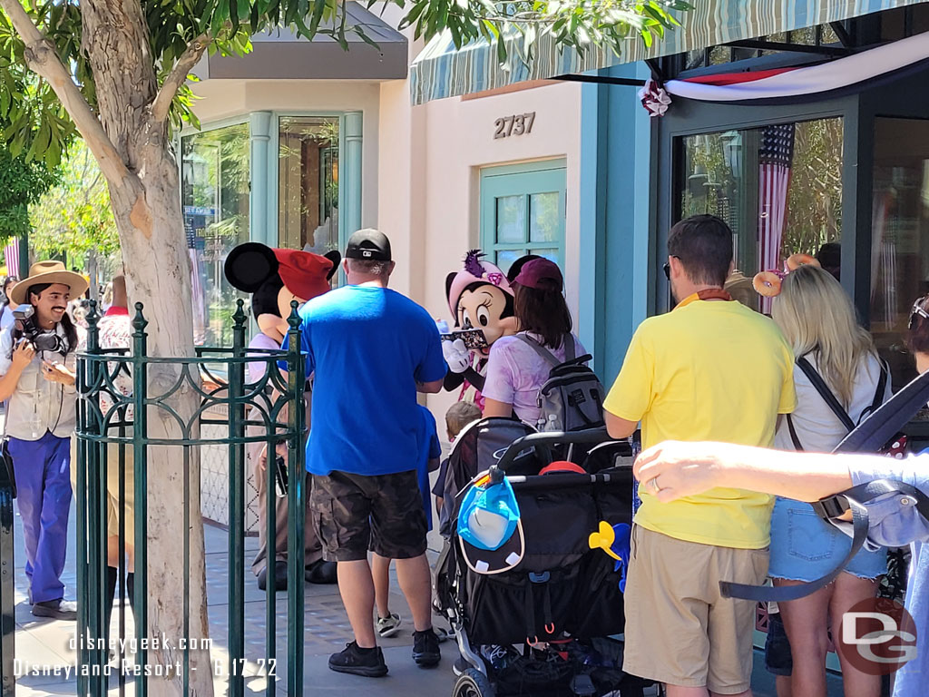 Mickey and Minnie visiting guests near Trolley Treats