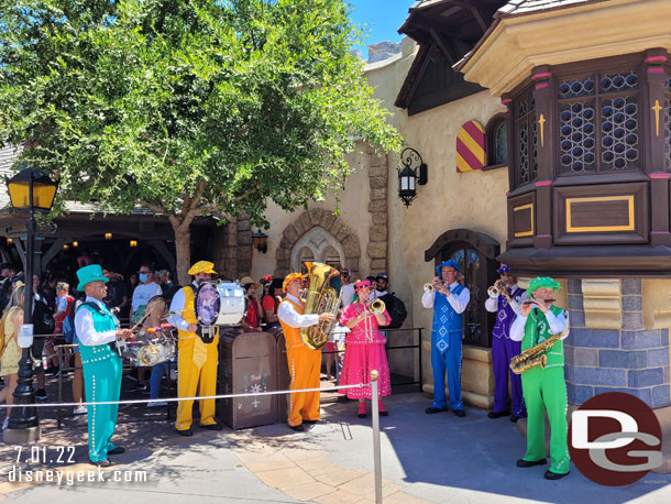 The Pearly Band performing near the Peter Pan queue. The managed to find a little shade for themselves.