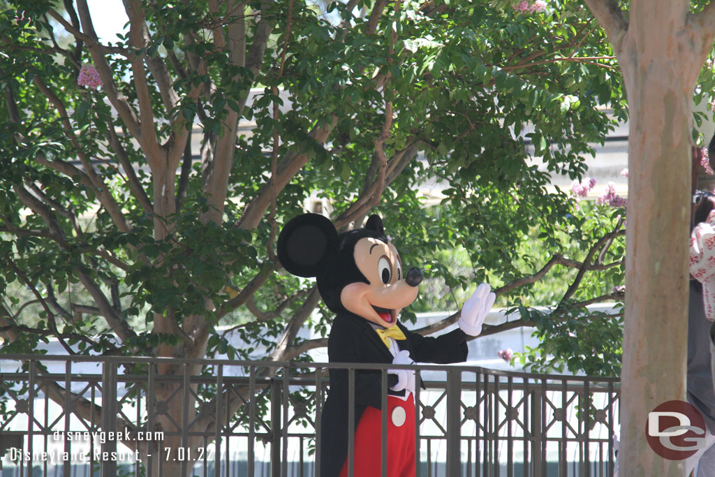 Mickey Mouse greeting guests in the small world mall area.  There was a line to wrapping up so you could see him clearly when I passed by.