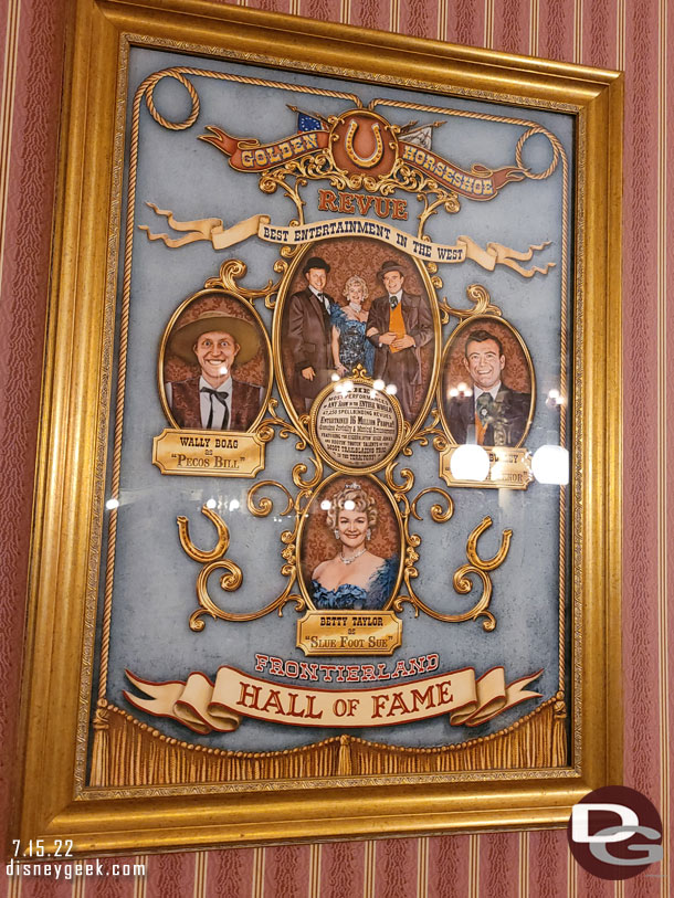 Stopped by the Golden Horseshoe to grab a snack and ended up seated under the Golden Horseshoe Review Frontierland Hall of Fame poster.