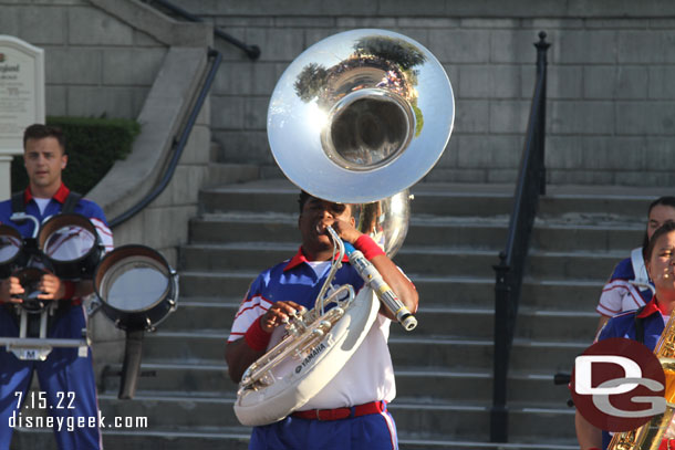 Playing the sousaphone while holding a lightsaber