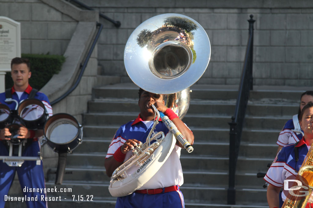 Playing the sousaphone while holding a lightsaber