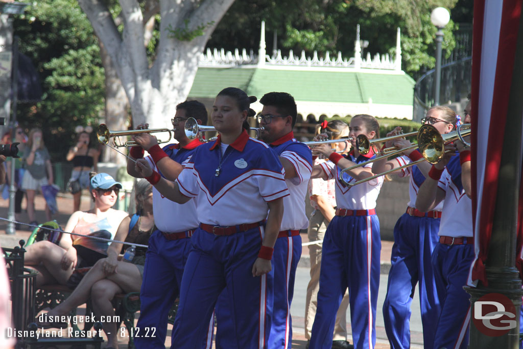 The 2022 Disneyland Resort All-American College Band arriving for the nightly Flag Retreat in Town Square.