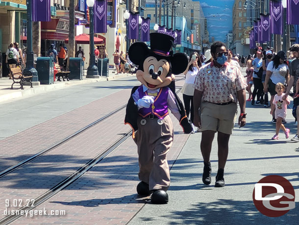 Mickey Mouse on his way to meet guests on Buena Vista Street in his Halloween outfit.