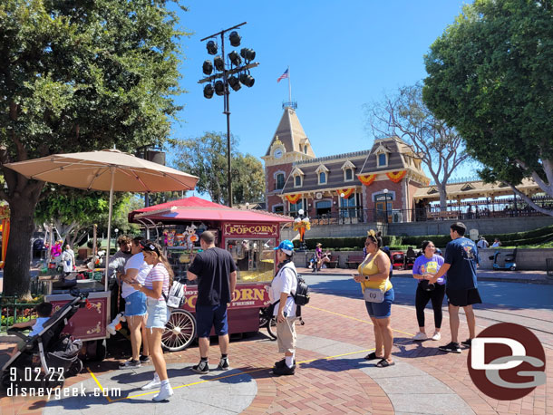 A handful of guests in line for the Mummy Mickey popcorn bucket.