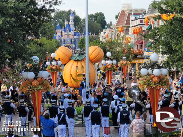 The Disneyland Band & Dapper Dans join the security honor guard to lower the flags in Town Square