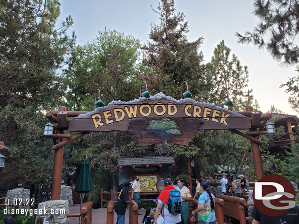 Redwood Creek sign has a halloween party sign on it.