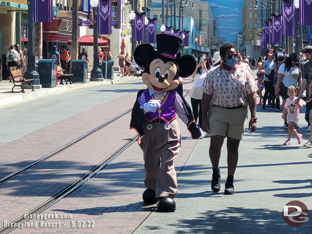 Mickey Mouse on his way to meet guests on Buena Vista Street in his Halloween outfit.