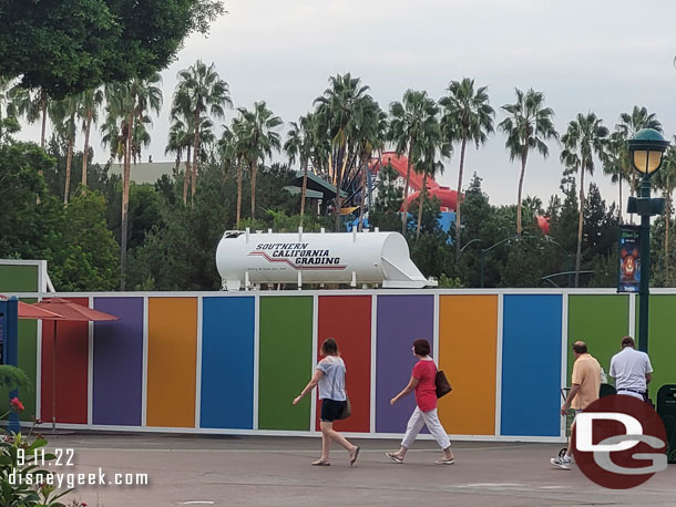 Grading is underway on the Downtown Disney project a water tank is visible over the wall.