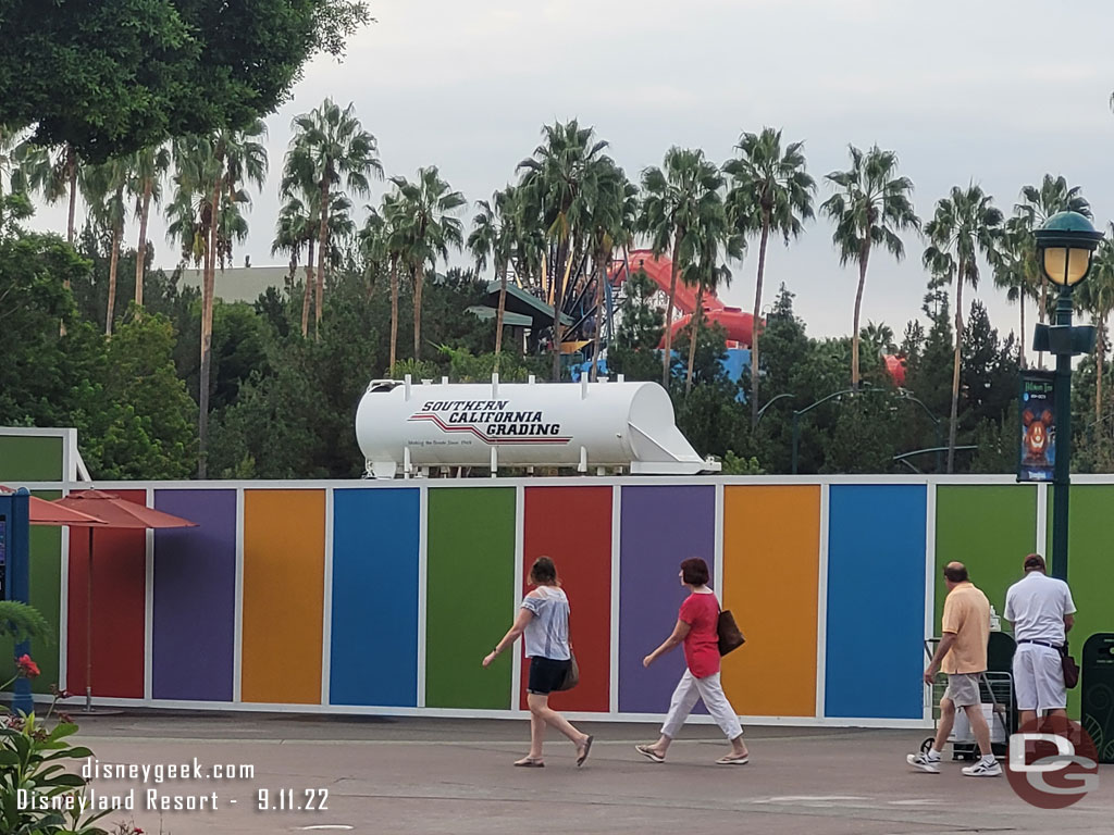 Grading is underway on the Downtown Disney project a water tank is visible over the wall.