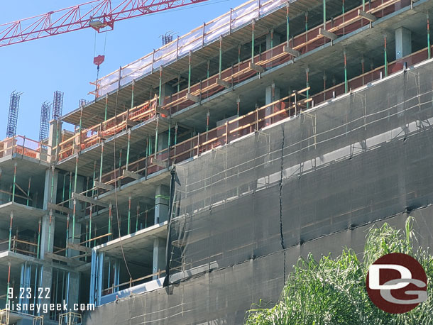 Scaffolding covers most of the building as they are working to install the windows and exterior elements.