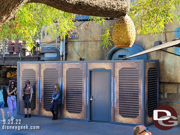 In Star Wars: Galaxy's Edge walls are still up, several cast members in the area again this visit (a handful are out of frame too).