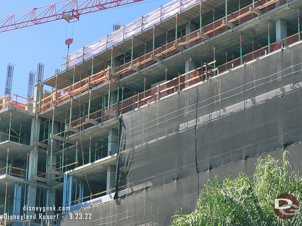 Scaffolding covers most of the building as they are working to install the windows and exterior elements.