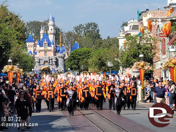 A Band from Idaho marching through the park.